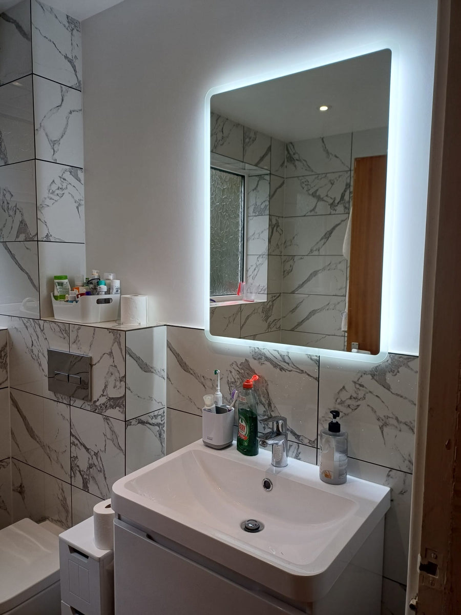 Backlit LED mirror above the vanity unit
