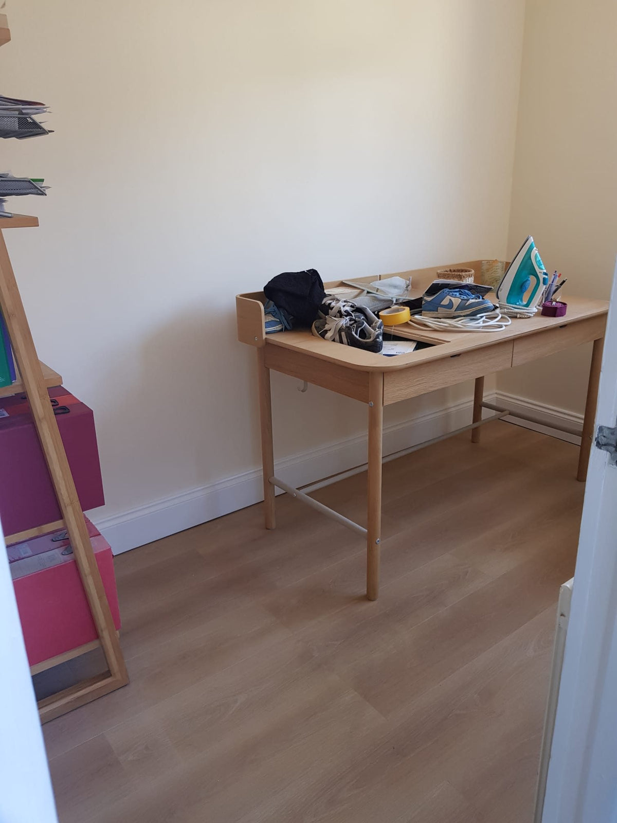 A finished room with wood-effect flooring