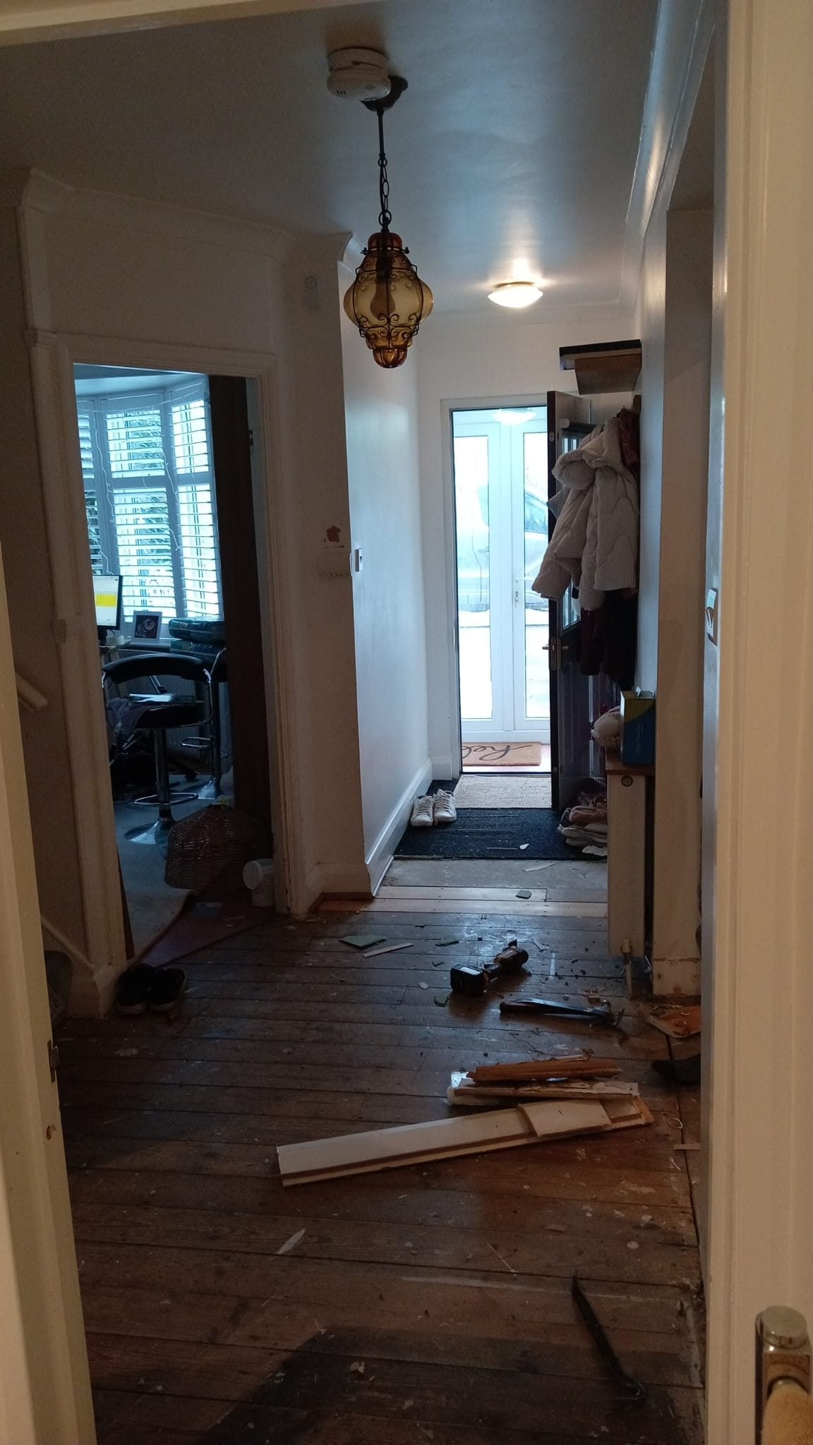 The hallway with the old flooring taken up