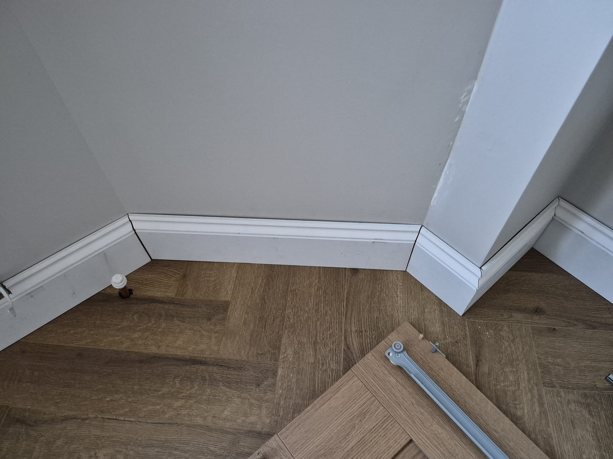 New skirting boards finishing the edges of the floor