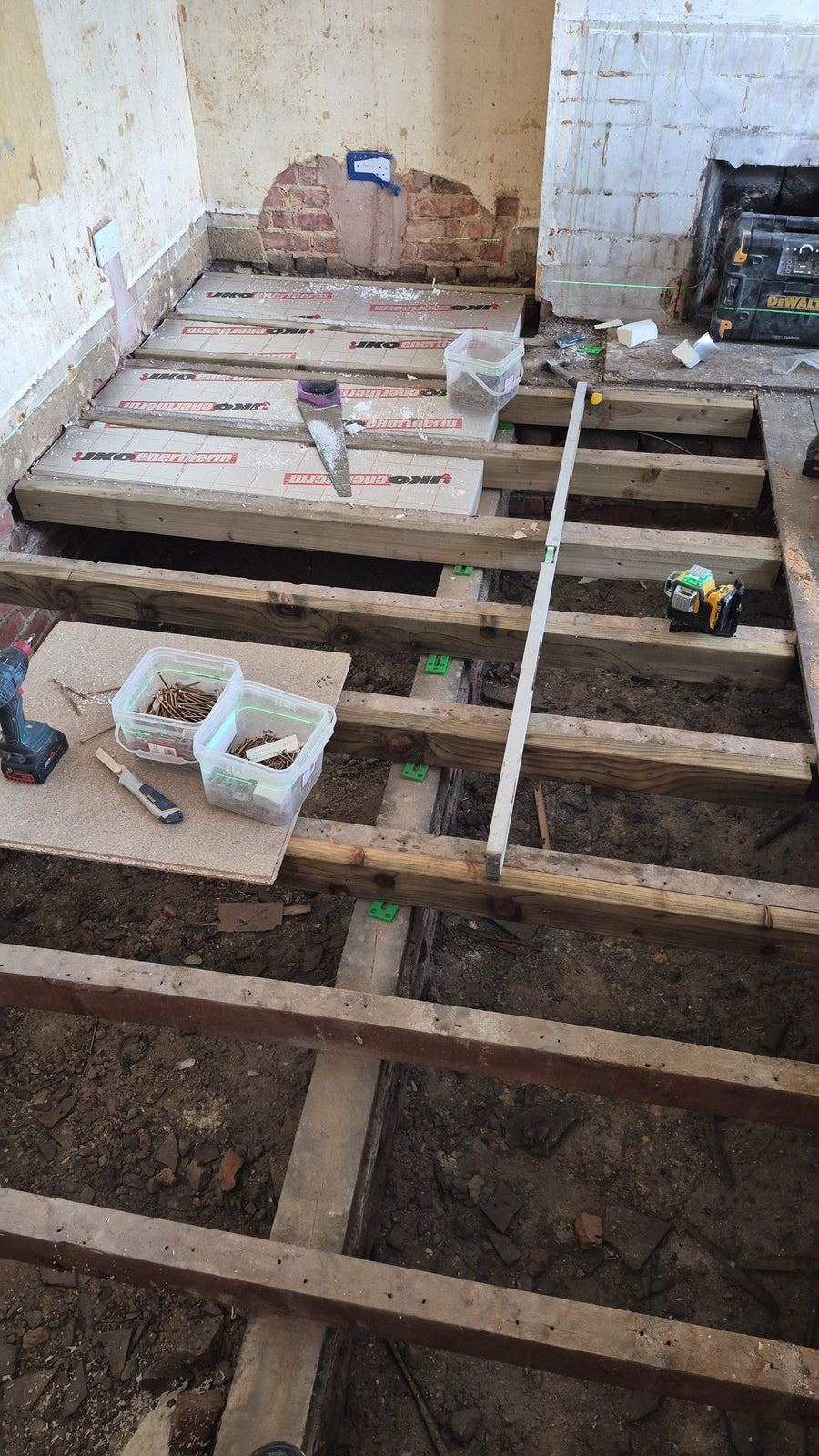 New timbers and insulation boards between the joists