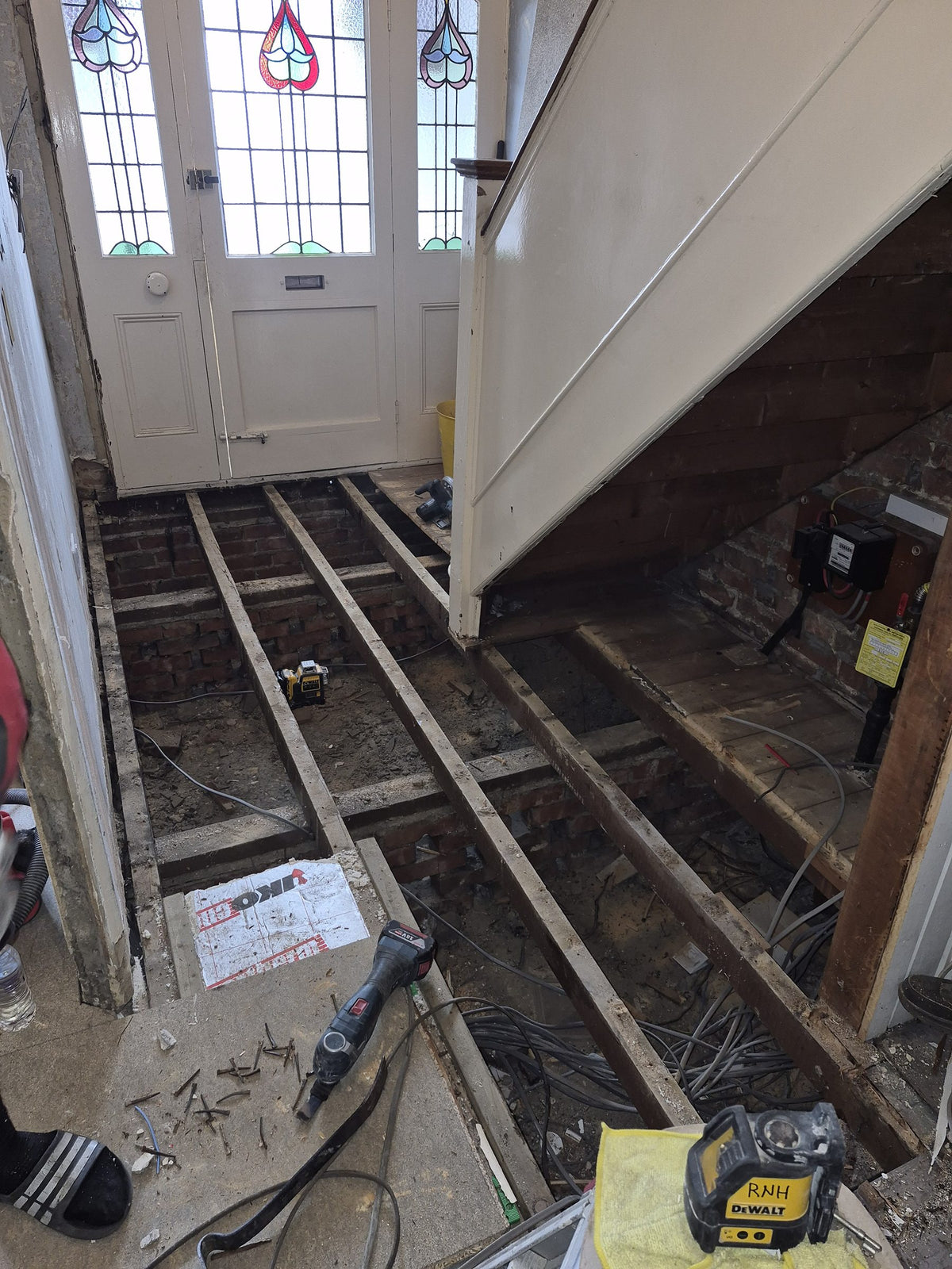 The hallway stripped back to the joists