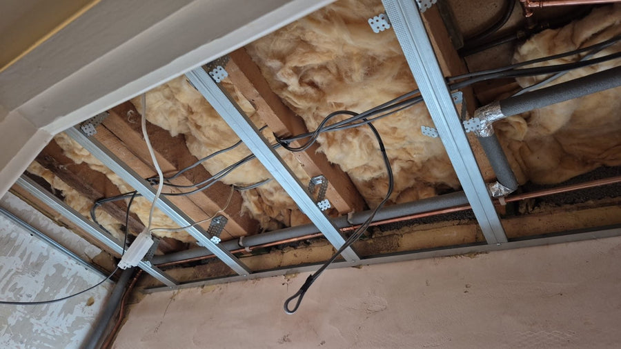 Metal framing fixed to the ceiling ready for plasterboard