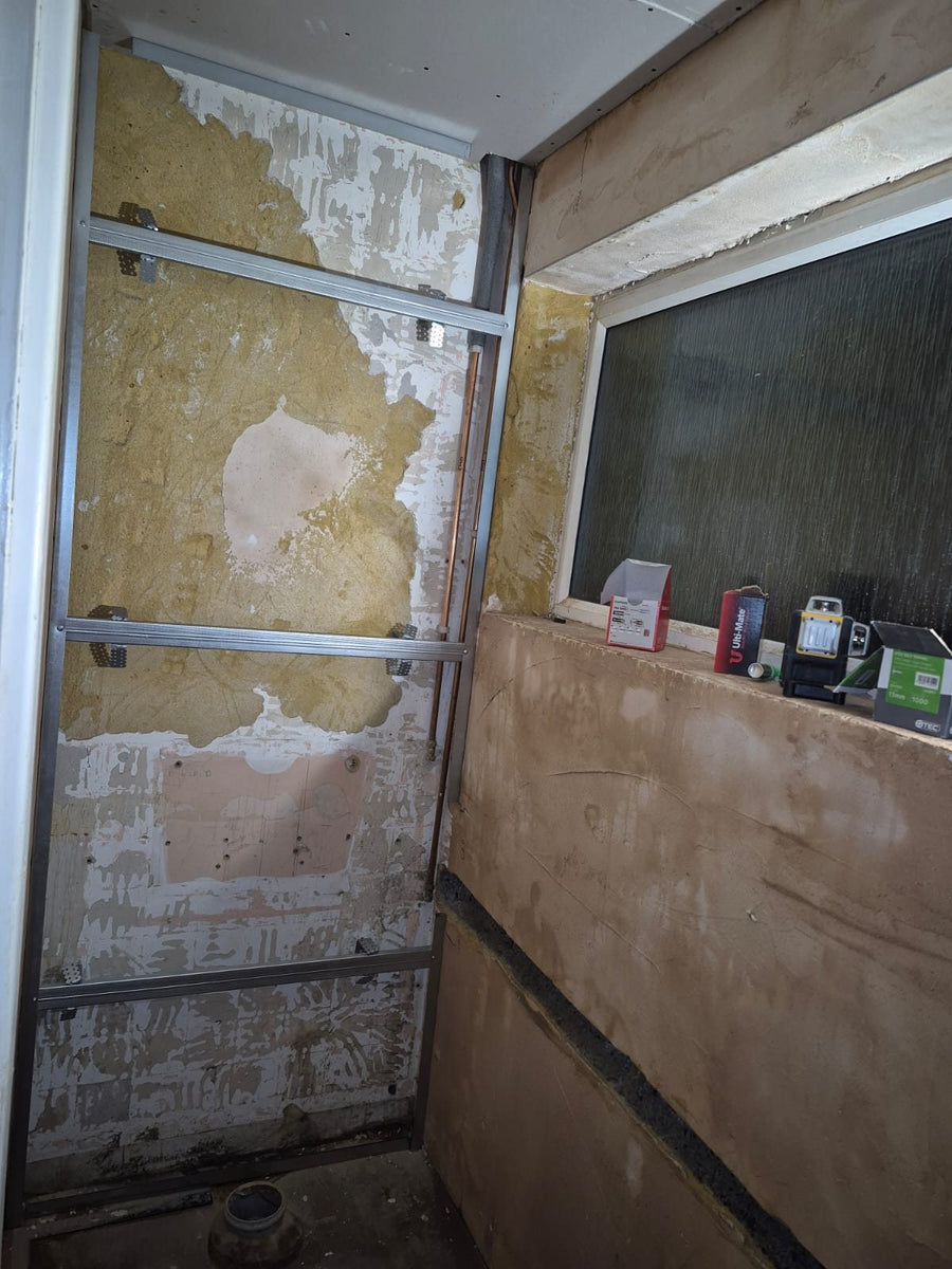 Metal stud framing around the window wall