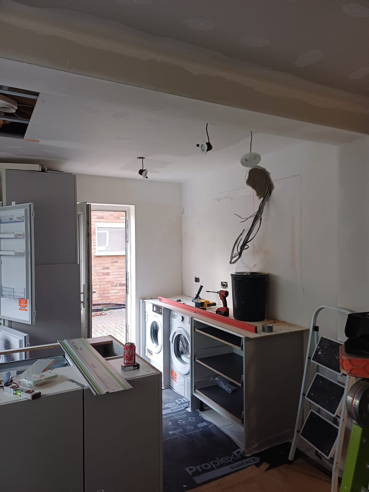 Kitchen units being fitted
