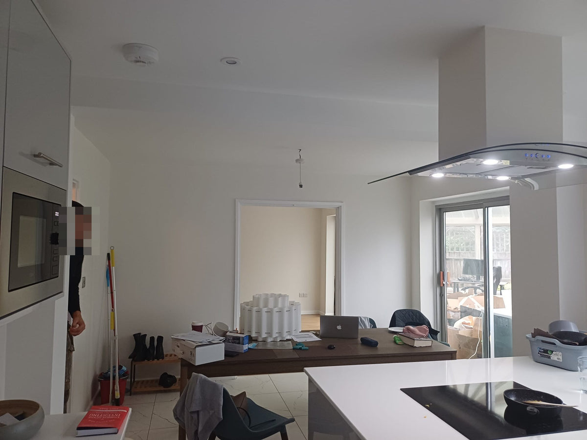 The island hob and built-in oven, looking towards the garden doors