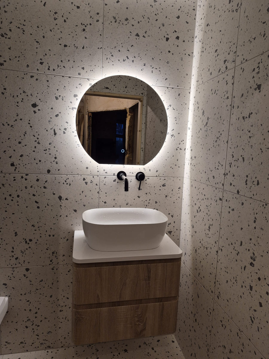 Backlit LED mirror above the wall-hung vanity unit