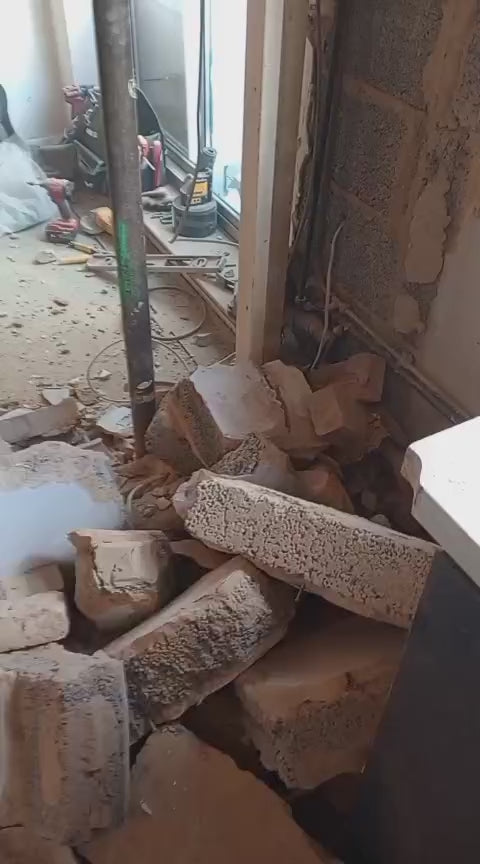 Video of the wall knocked through, with props in place