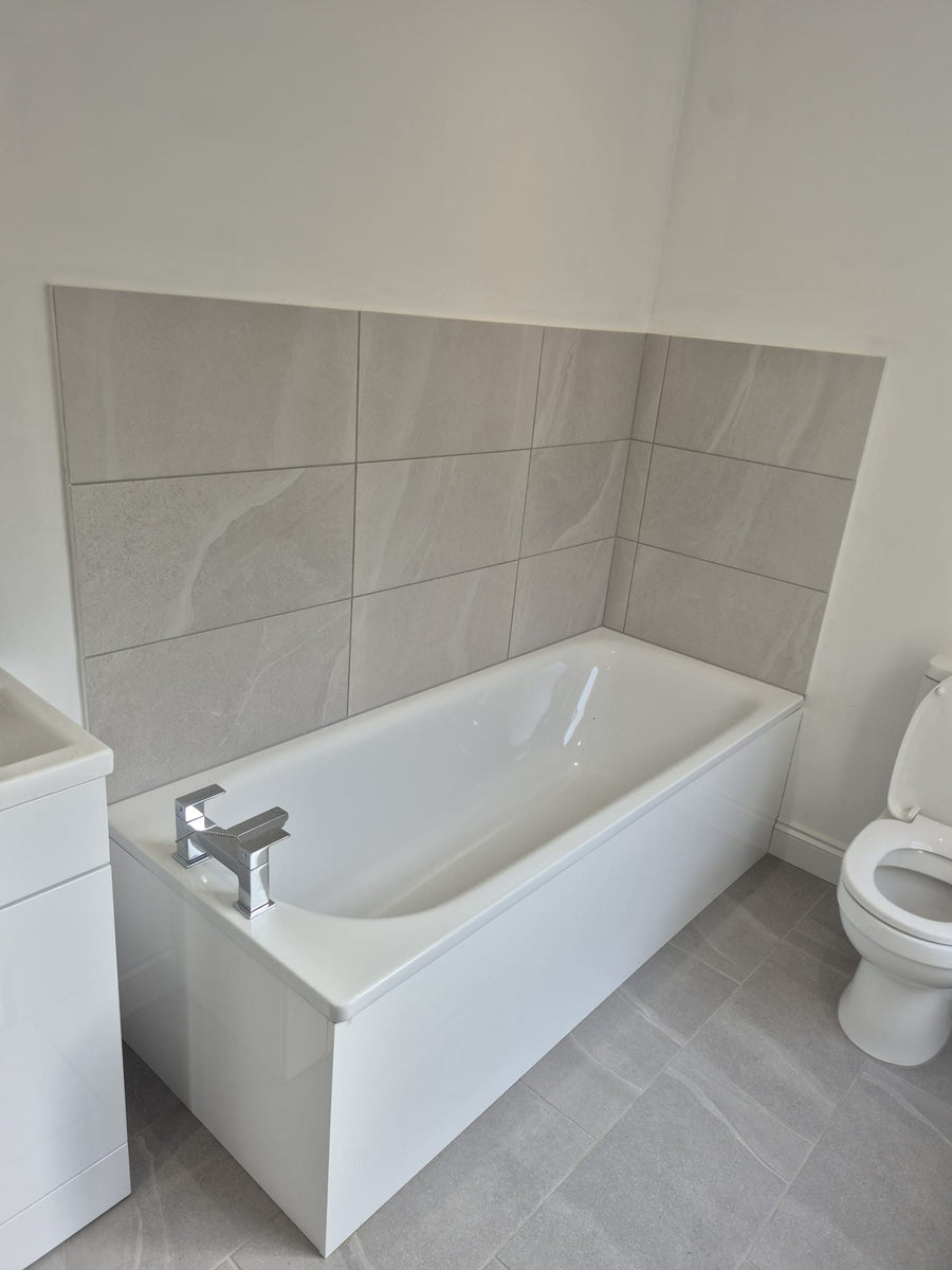 New bath with a tiled surround