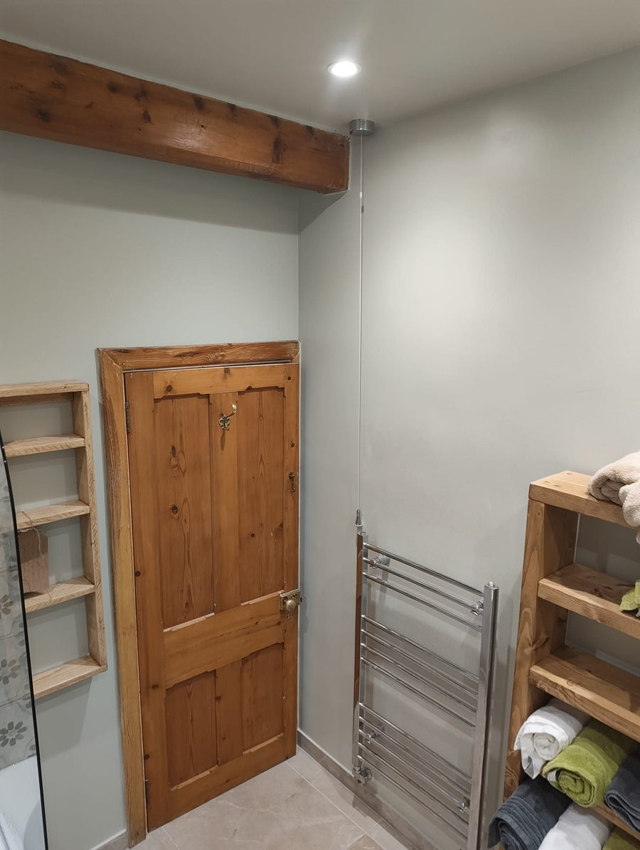 Heated towel rail and built-in timber shelves