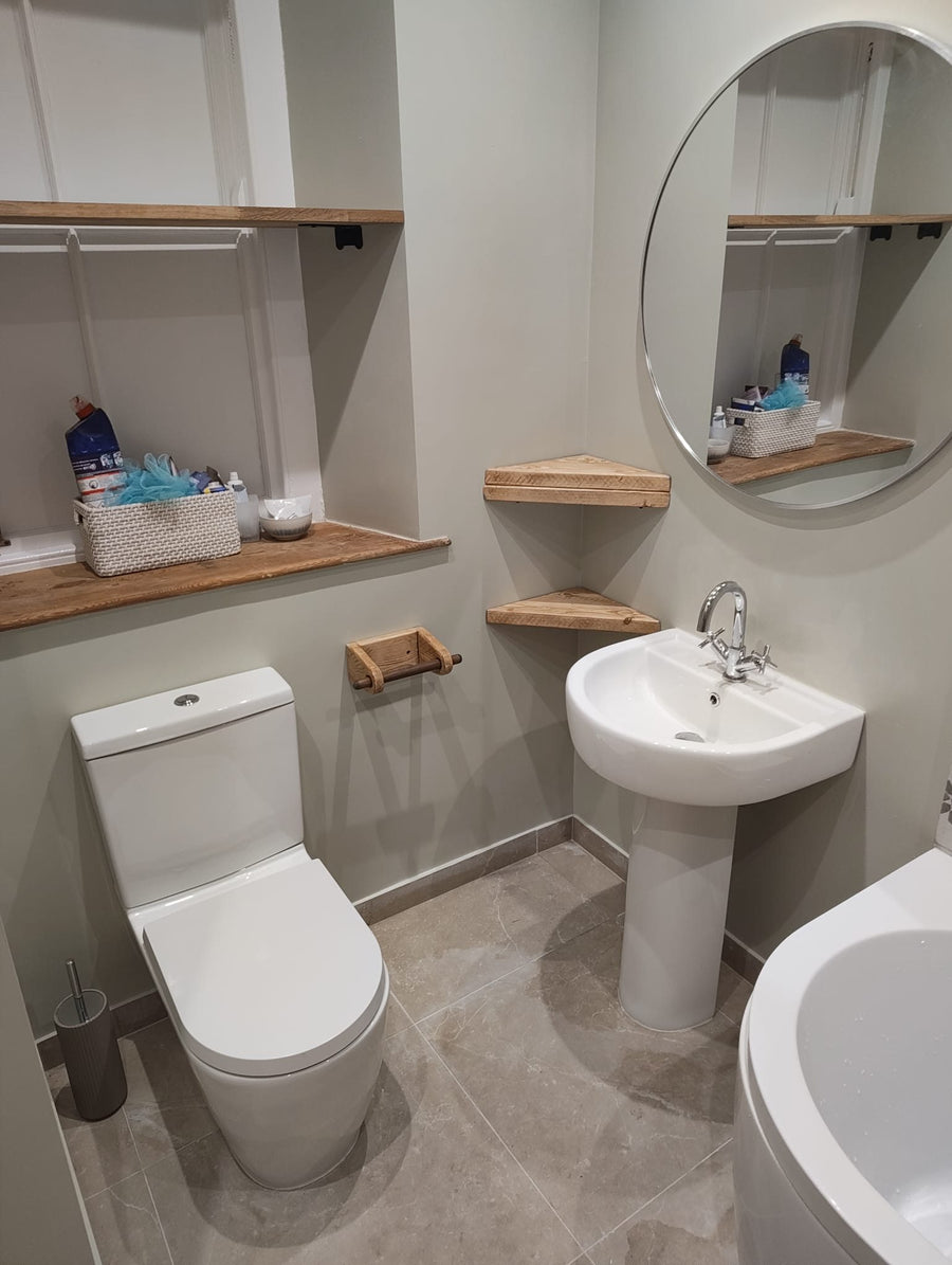 Close-coupled toilet and pedestal basin with a round mirror