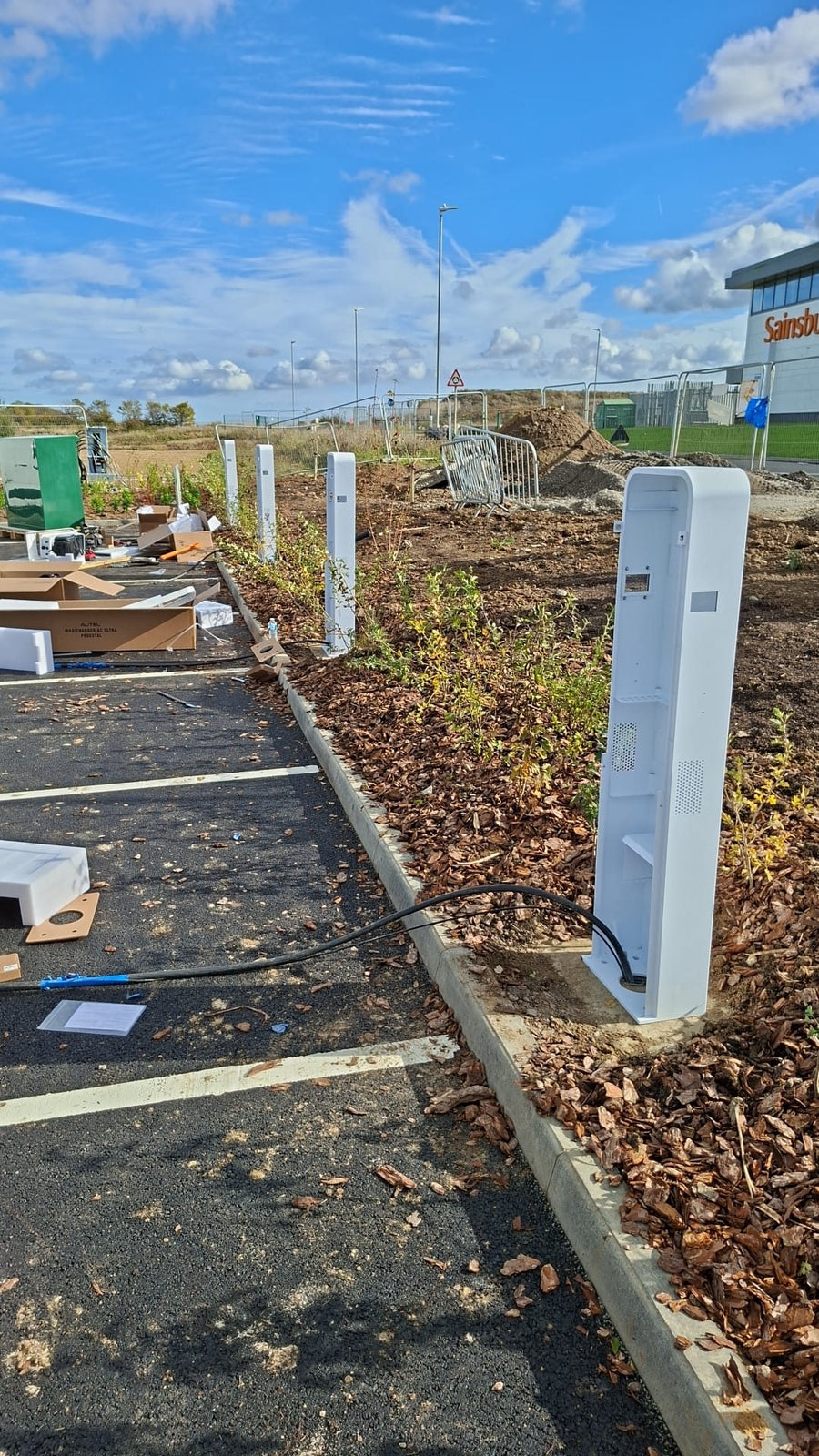 A charging post in place beside the bays