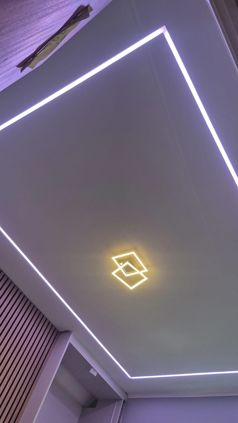 Recessed LED strip lighting around the ceiling