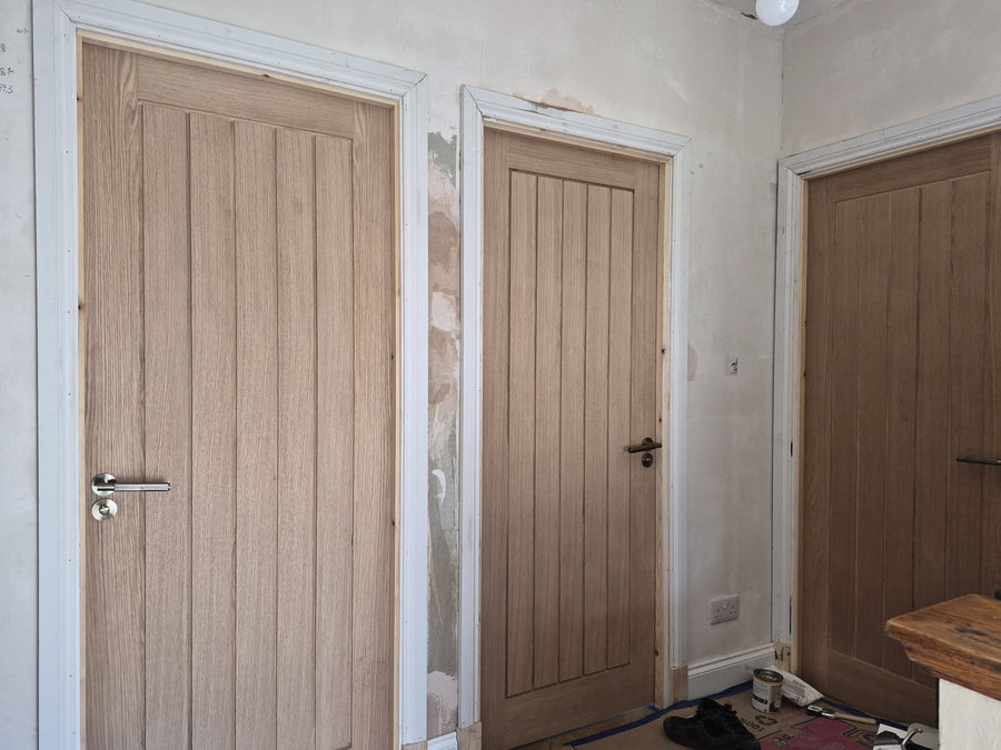 Three new oak internal doors on a landing