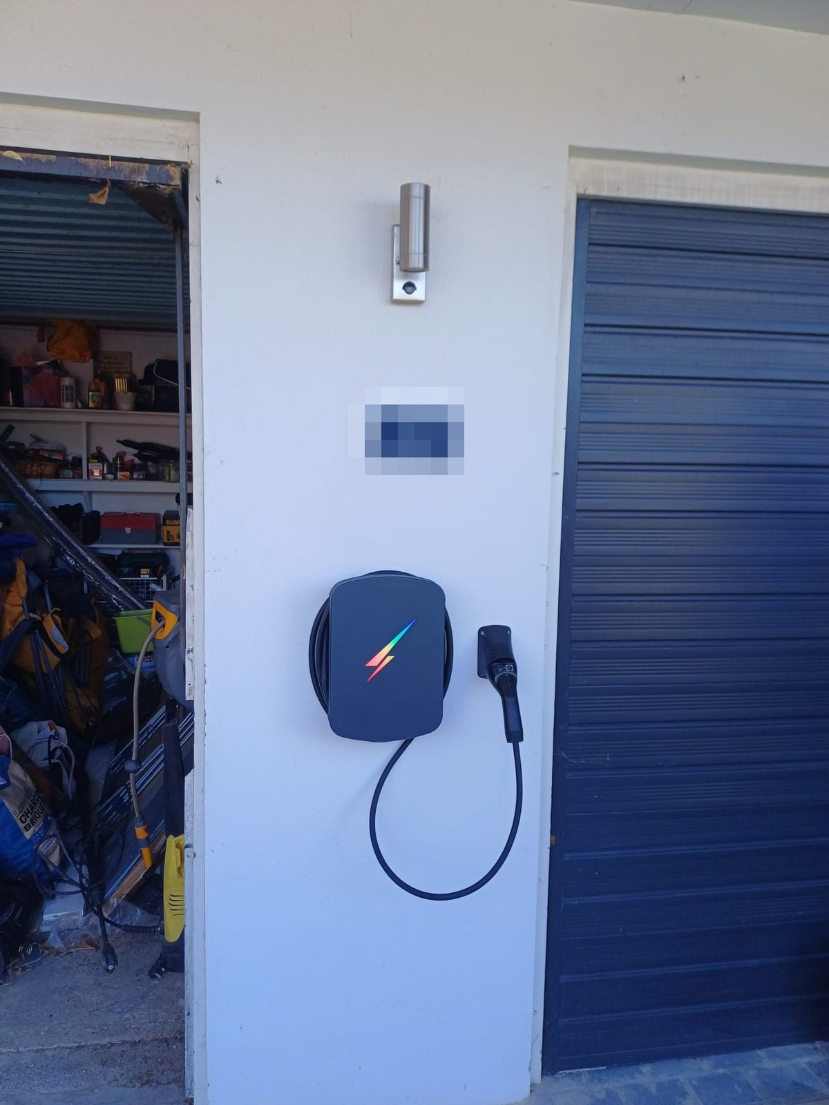 The charger with its tethered cable