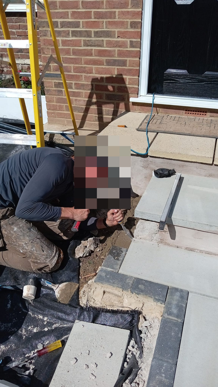 Laying the block edging beside the new path