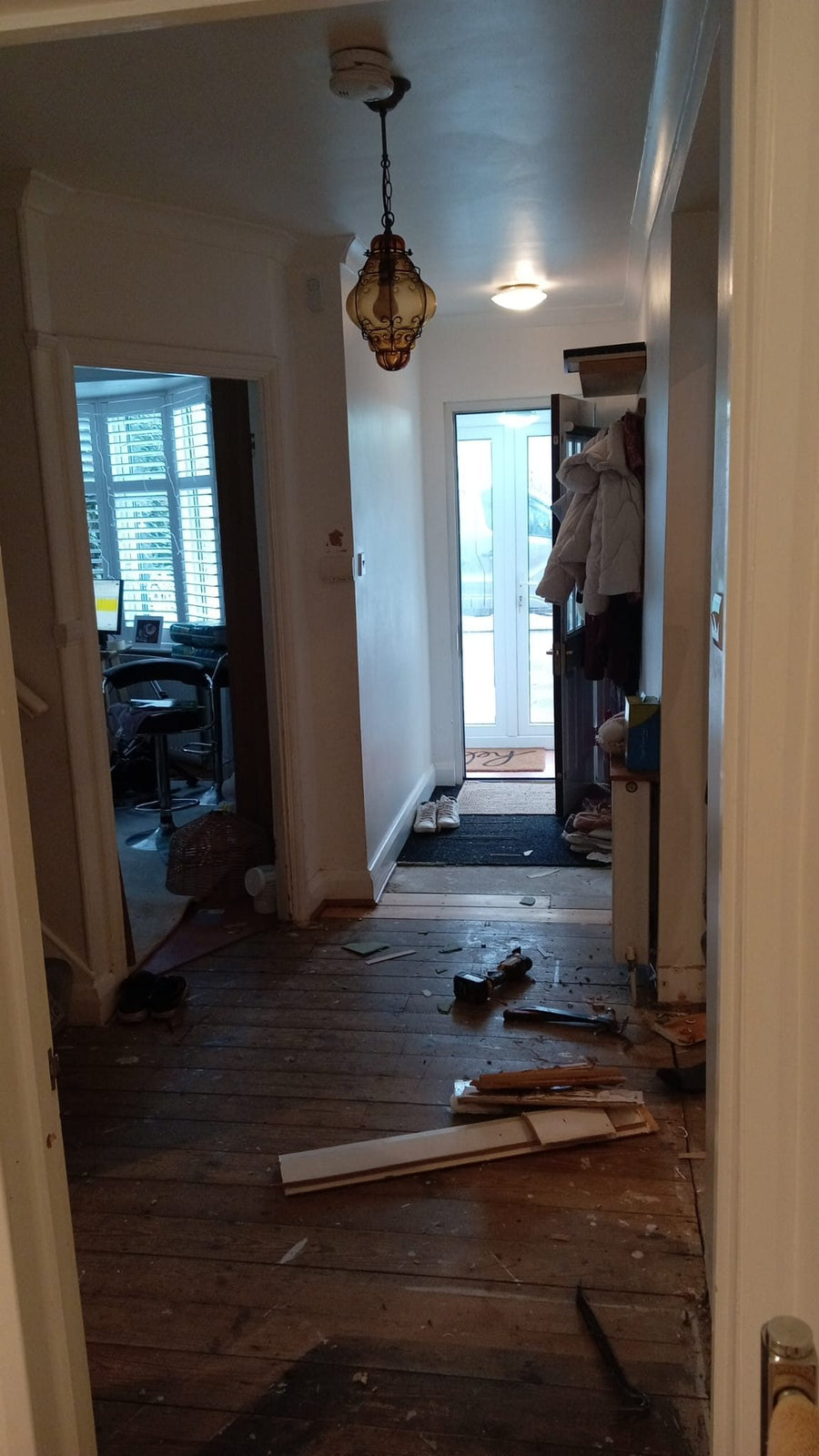 The hallway with the old flooring taken up