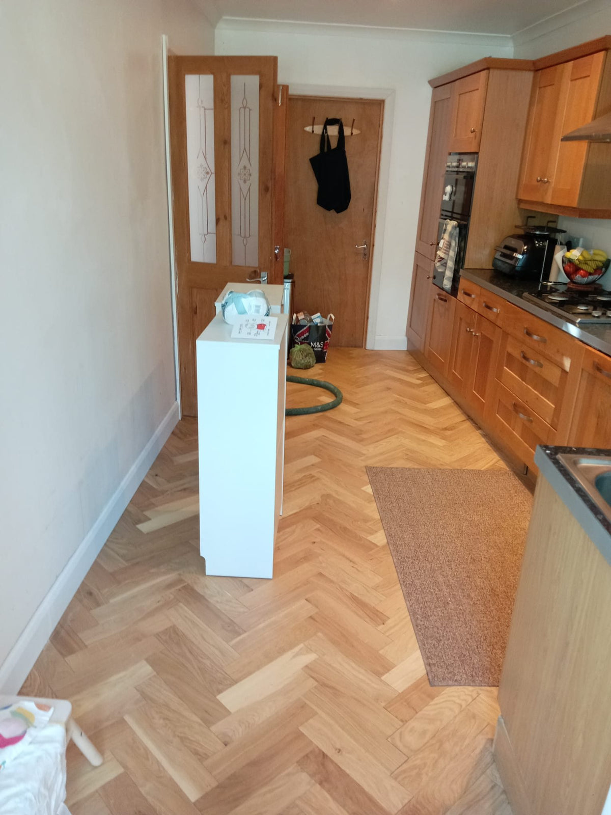 Herringbone flooring finished through the kitchen
