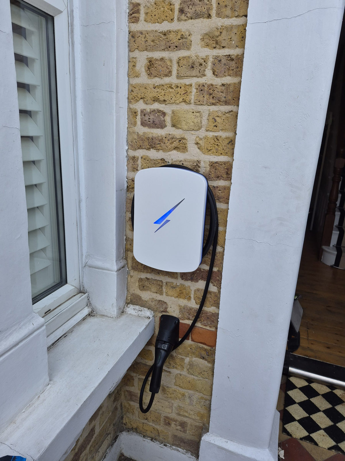 The finished charger mounted beside the front window