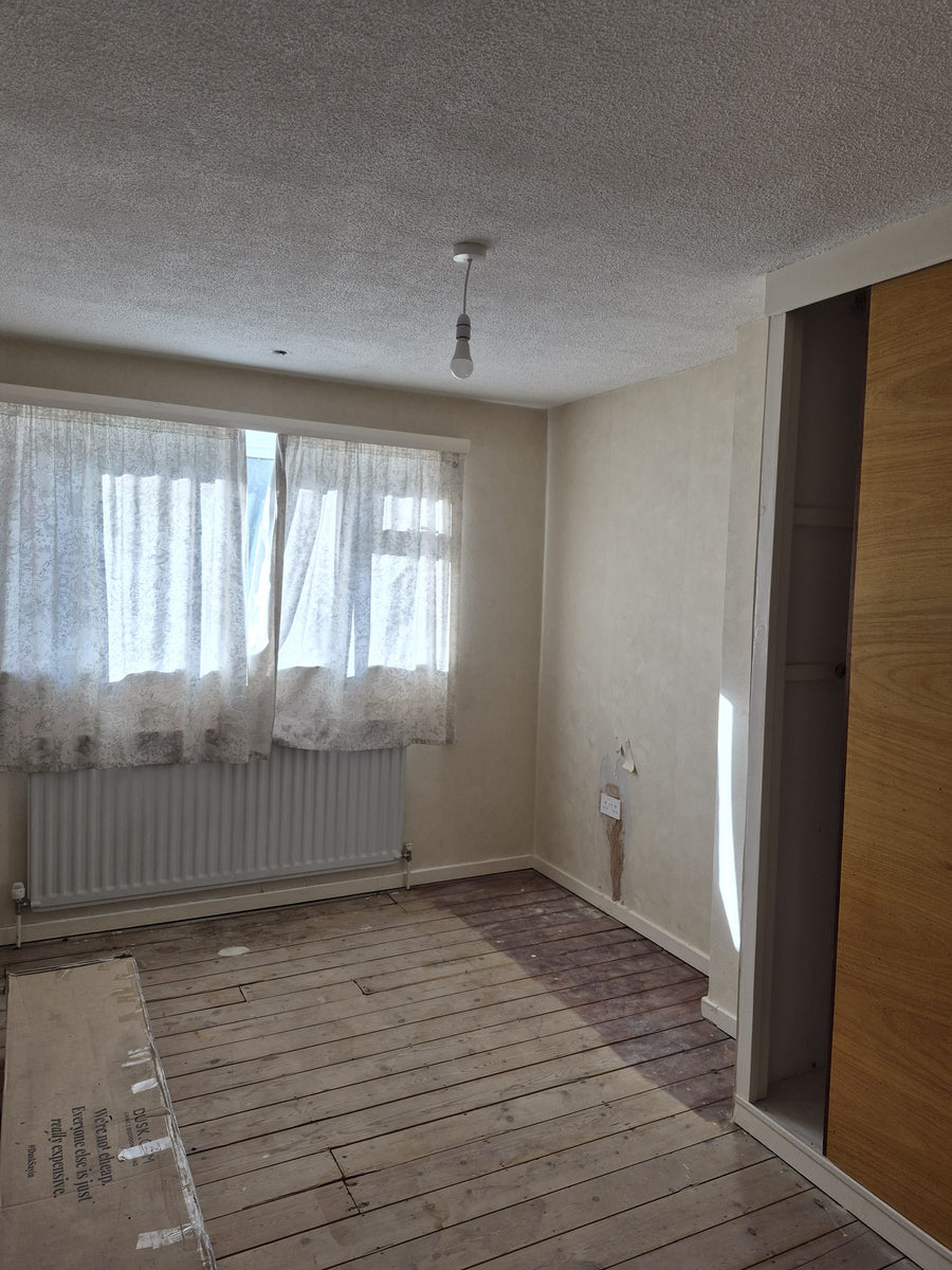Chased walls and lifted floorboards in a bedroom
