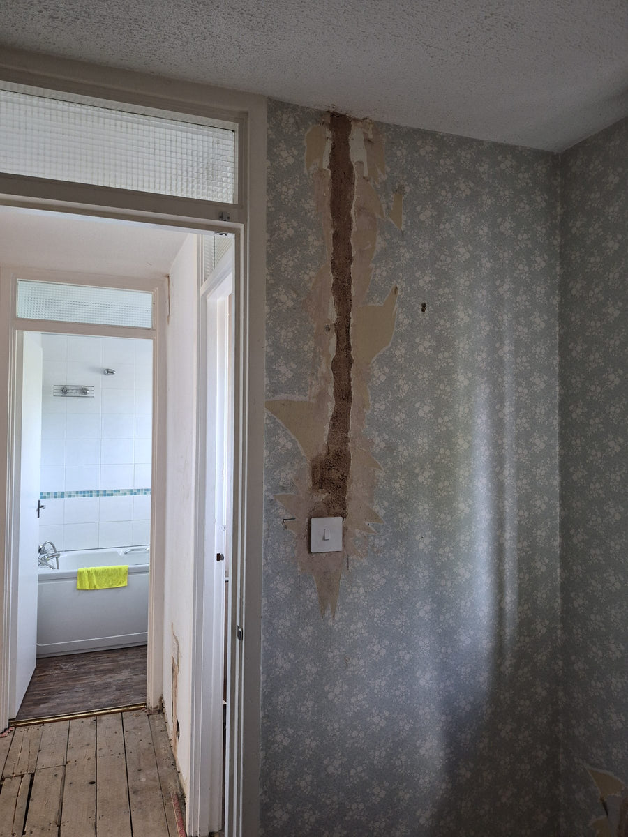 A cable chase through the hallway wall
