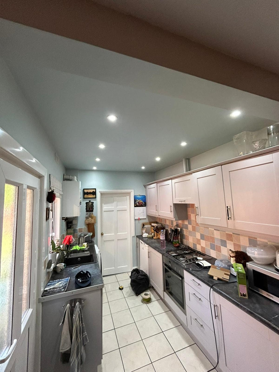 After: LED downlights along the kitchen ceiling