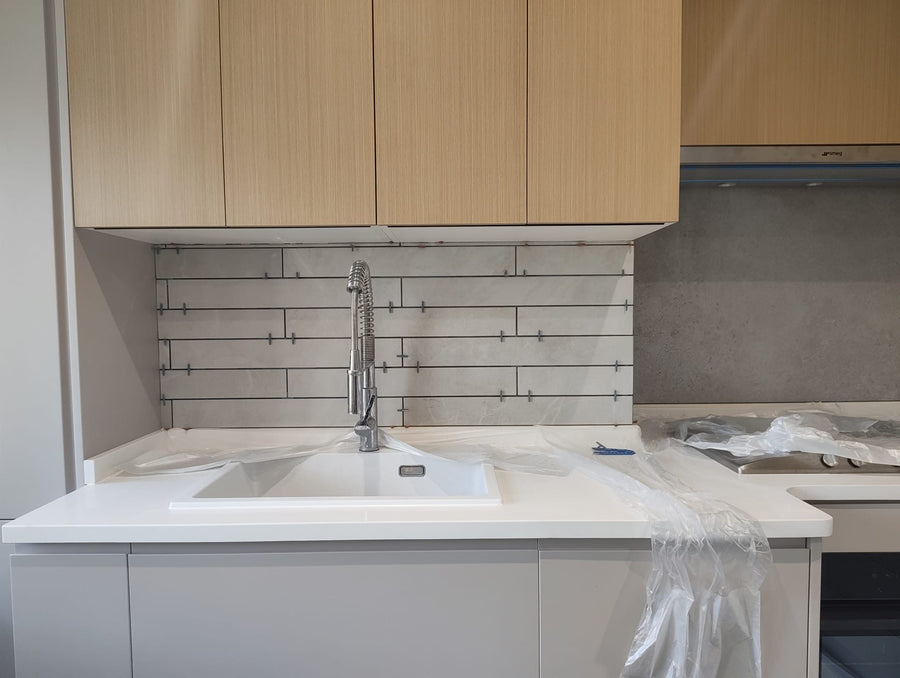 Tiled splashback behind the sink