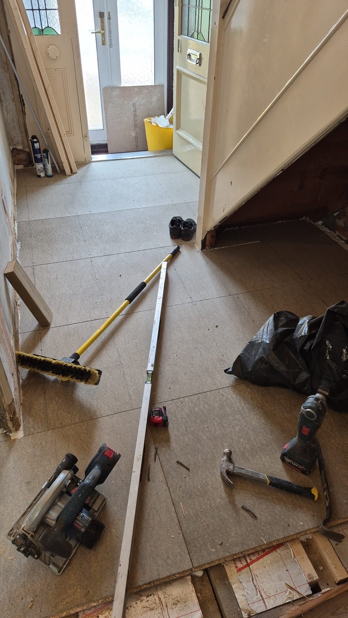 New subfloor boards laid in the hallway