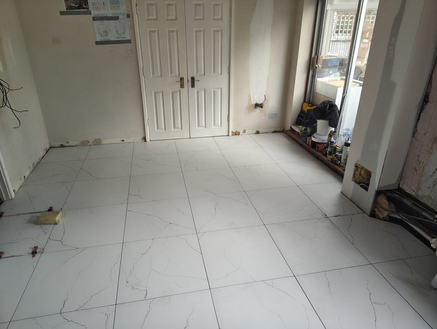 The tiled floor running through to the double doors
