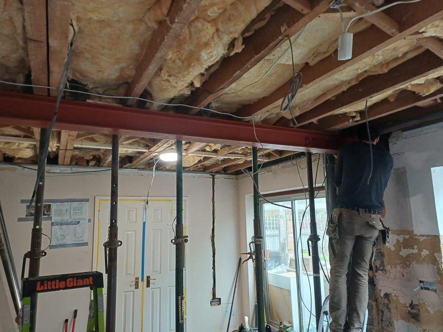 The steel beam across the opened-up room