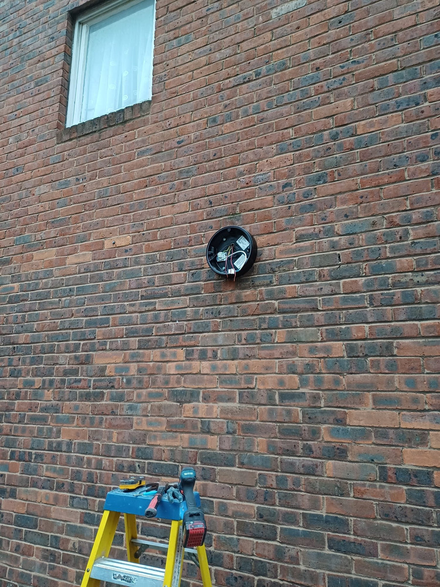 Fitting a new wall light on the side of the block