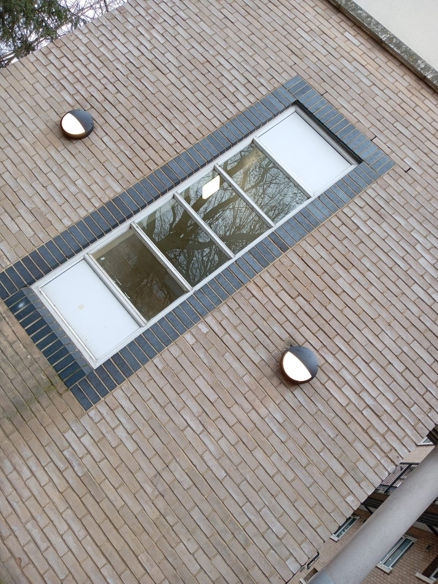Bulkhead lights either side of a window