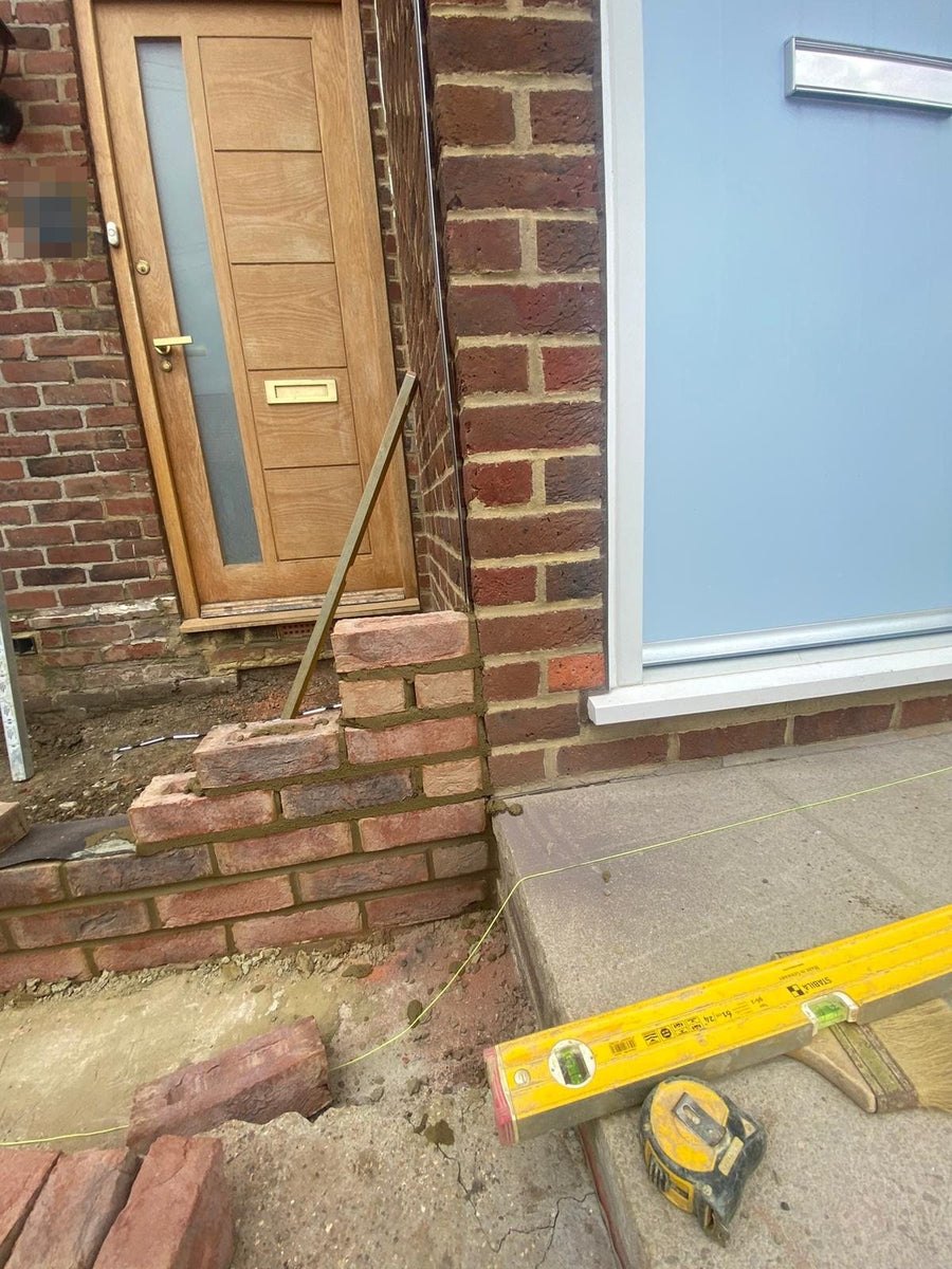 First courses of brickwork on the new foundations
