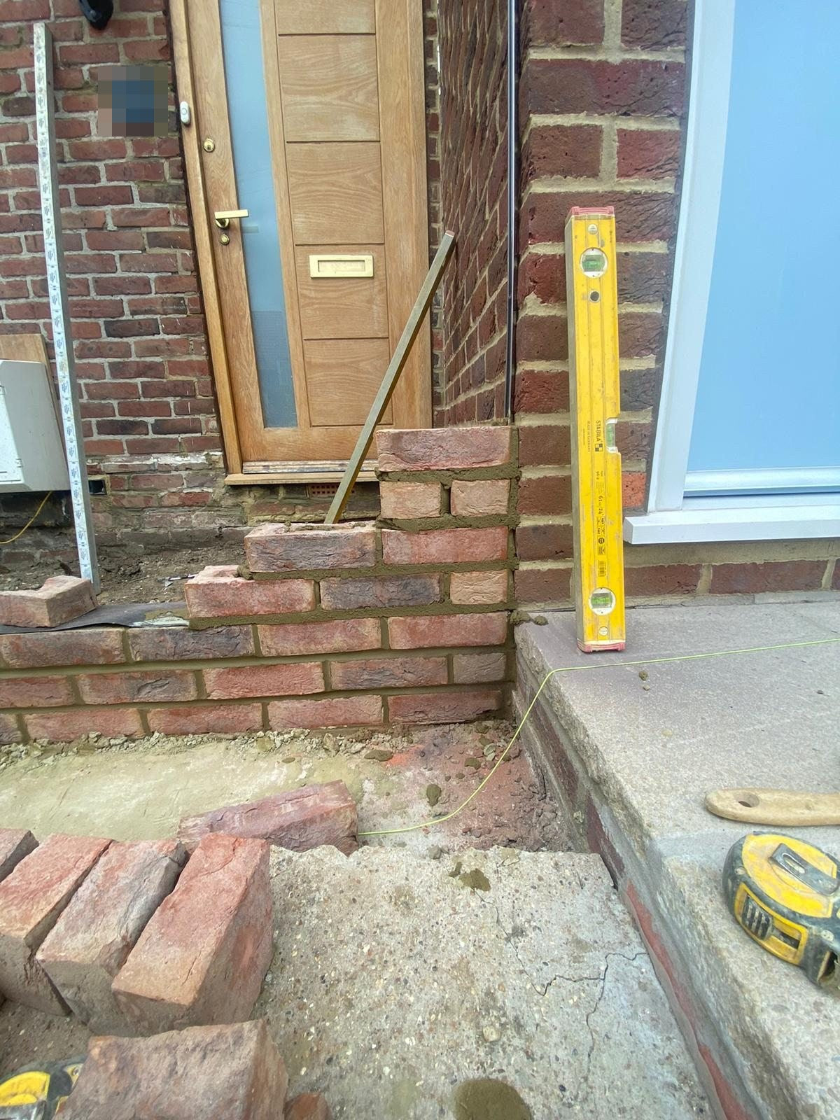 The porch walls built up and checked for level