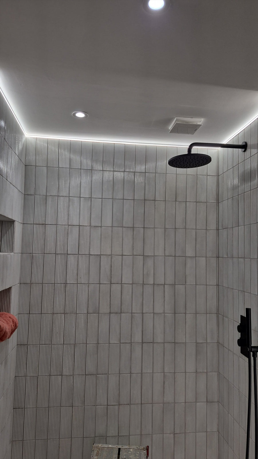 LED cove lighting around the ceiling above the shower